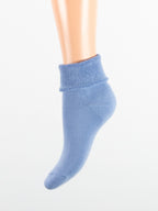 Calza con polsino taglio laser risvolto da donna